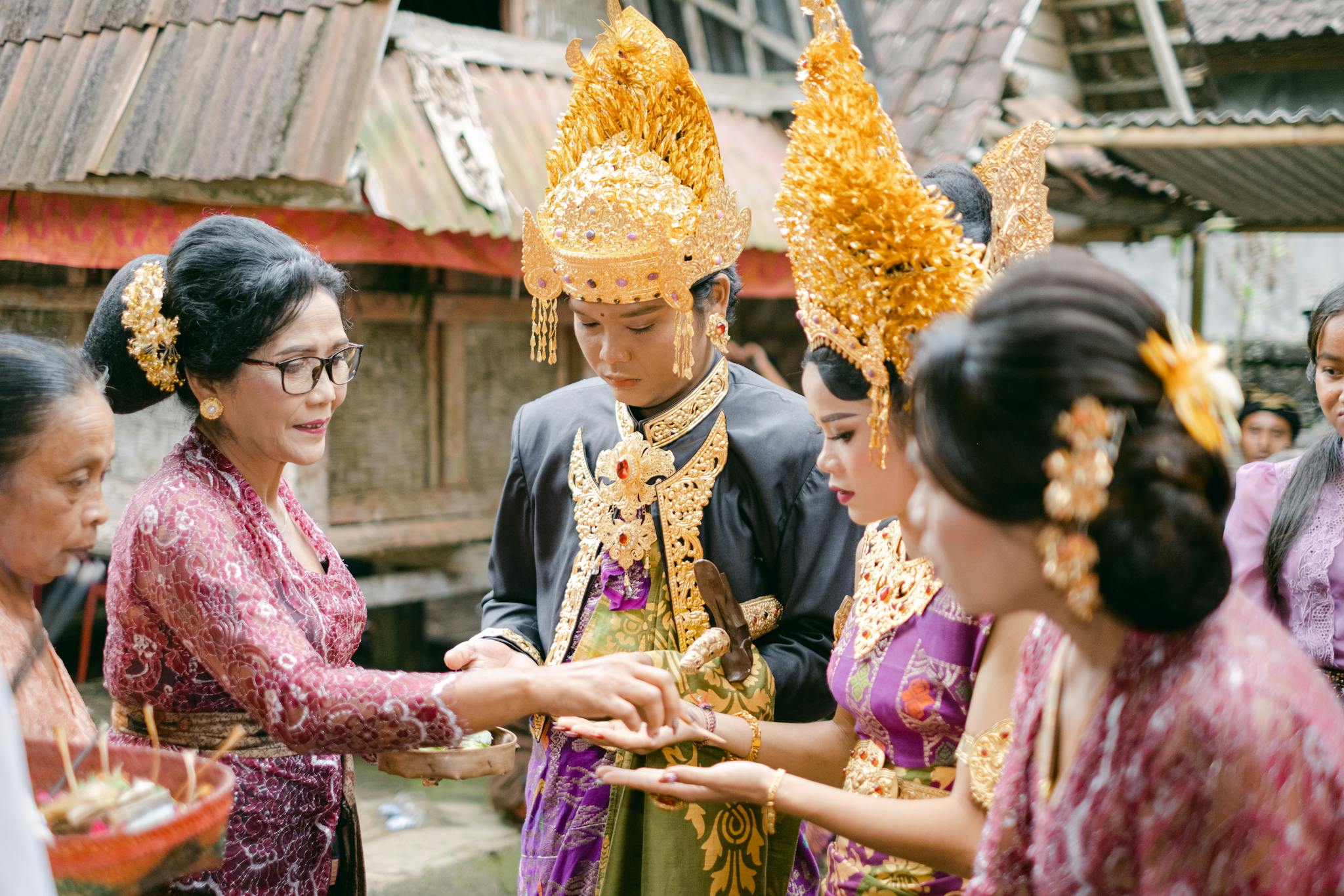 A vibrant scene from a traditional Balinese wedding with participants in ornate attire.